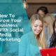 Two young women looking at a mobile phone discussing how to grow their business using social media