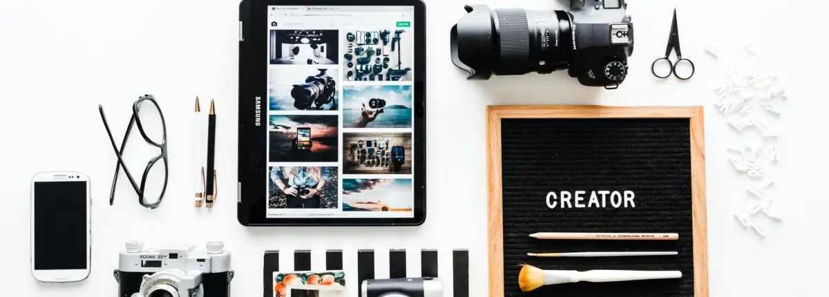 Desk with cameras and mobile phone