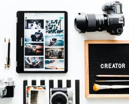 Desk with cameras and mobile phone