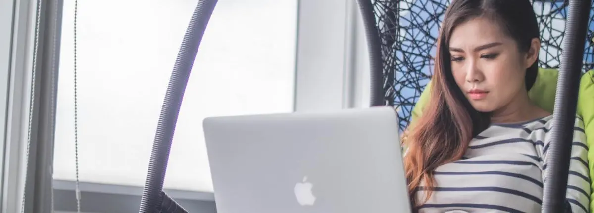 Woman looking at laptop